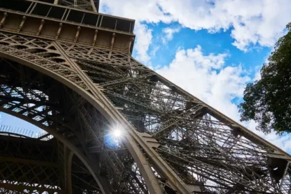 the wrought-iron lattice structure of the Eiffel Tower in Paris