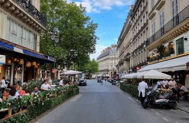 a classic Parisian brasserie featuring outdoor seating